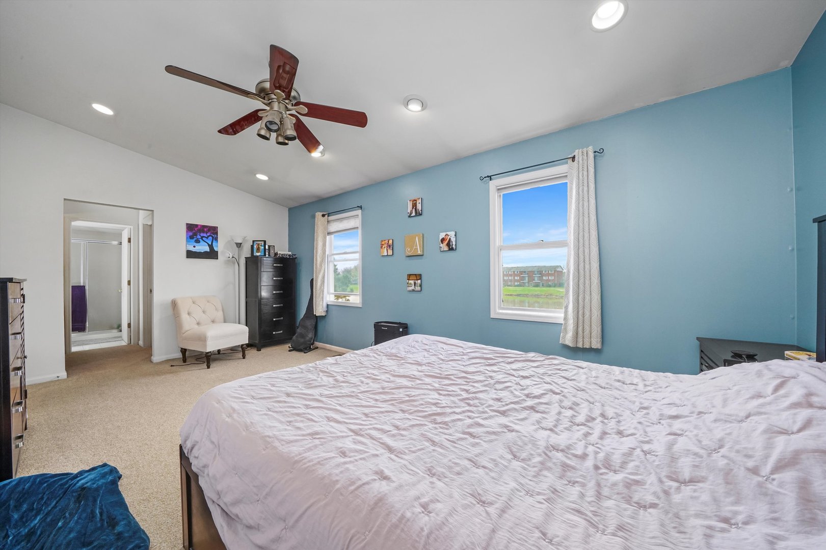 709 Daybreak Lane Carol Stream, IL 60188 - Photo 12 of 30 a bedroom with a large bed and a window
