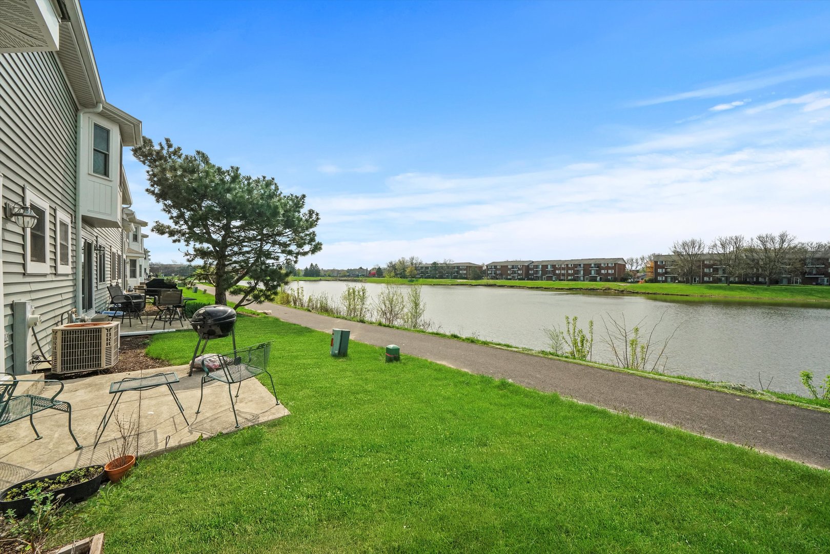 709 Daybreak Lane Carol Stream, IL 60188 - Photo 18 of 30 a view of a house with a yard and a lake view
