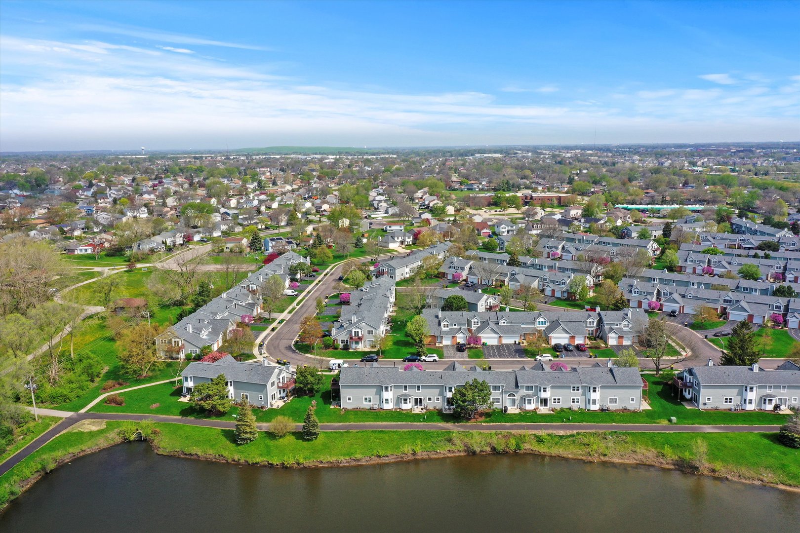 709 Daybreak Lane Carol Stream, IL 60188 - Photo 25 of 30 an aerial view of a city with lots of residential buildings ocean and mountain view in back