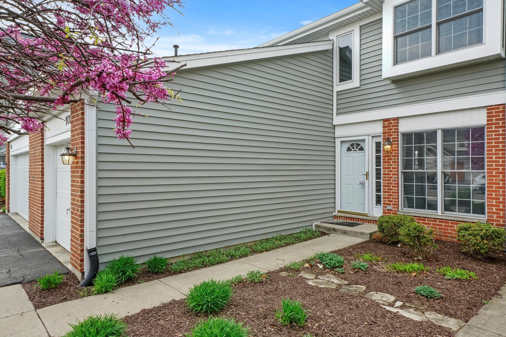 709 Daybreak Lane Carol Stream, IL 60188 - Photo 27 of 30 a front view of a house with garden