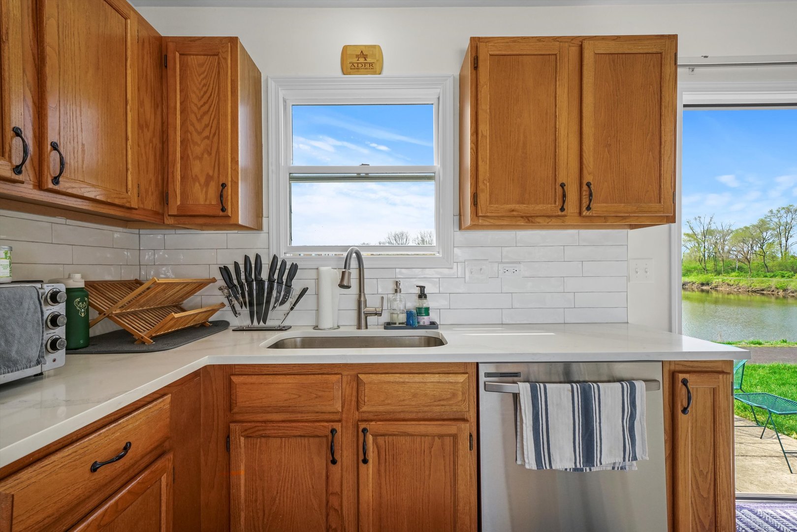 709 Daybreak Lane Carol Stream, IL 60188 - Photo 5 of 30 a kitchen with sink cabinets and window