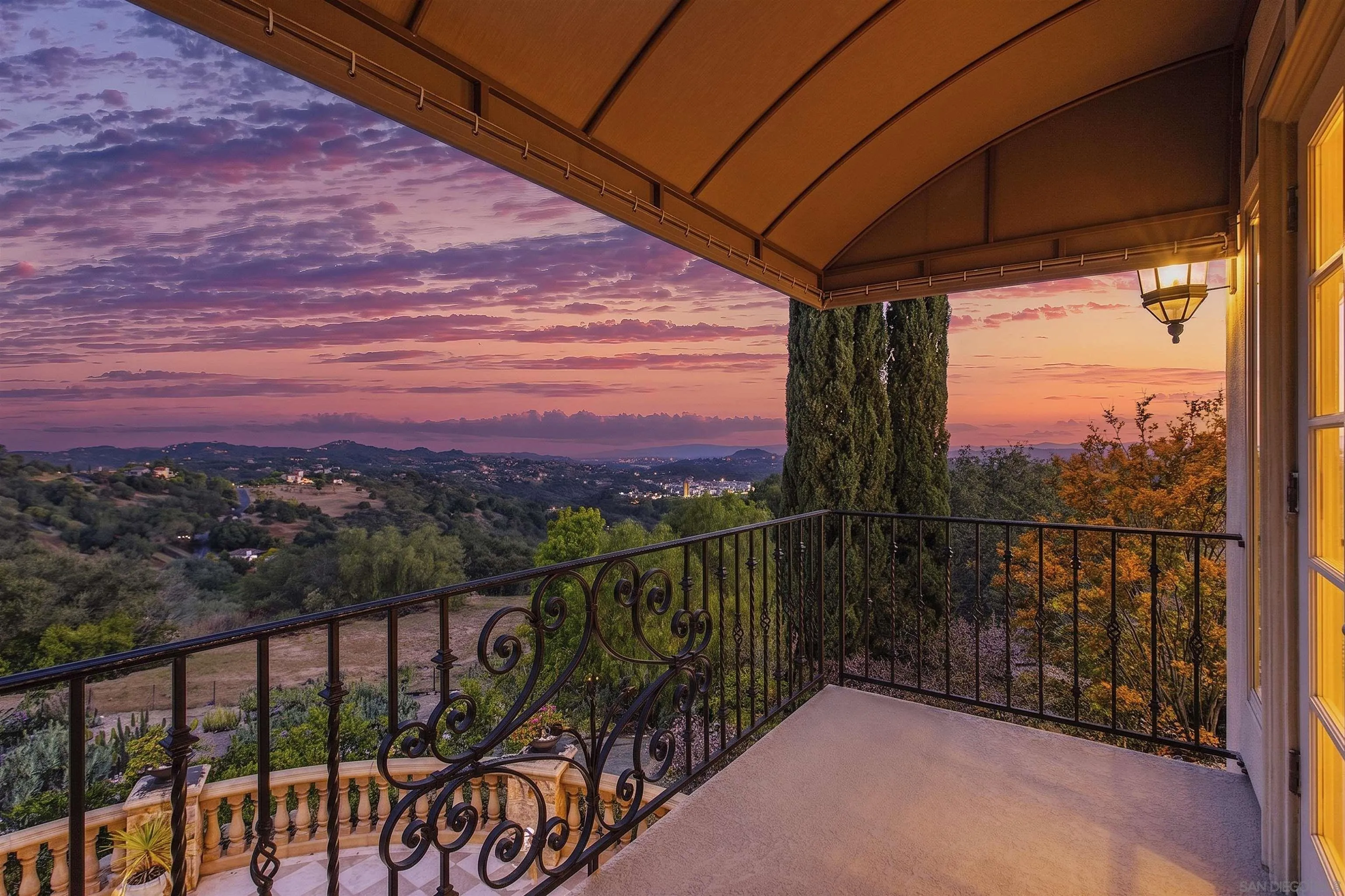 14440 Ridge Ranch Road Valley Center, CA 92082 - Photo 17 of 73 a view of a balcony with a floor to ceiling window and wooden fence
