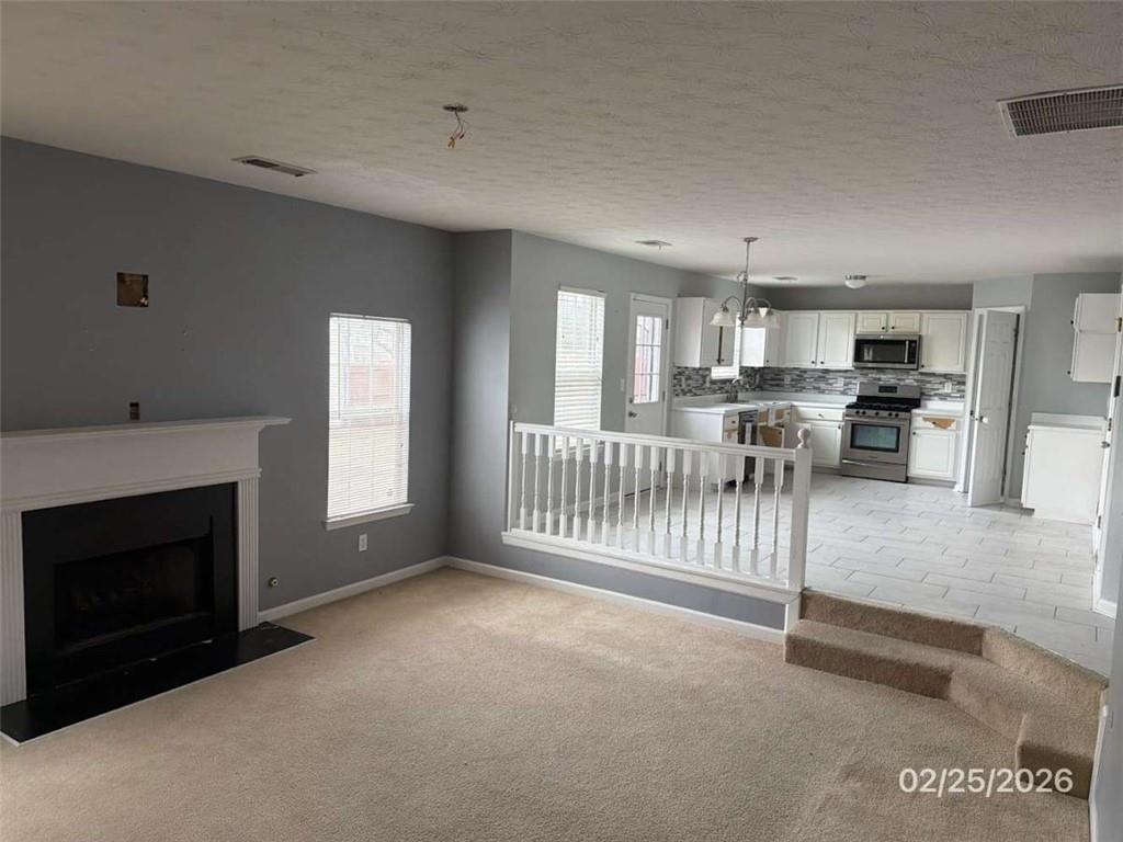 135 Timberlake Terrace Covington, GA 30016 - Photo 3 of 6 a view of livingroom with furniture and fireplace
