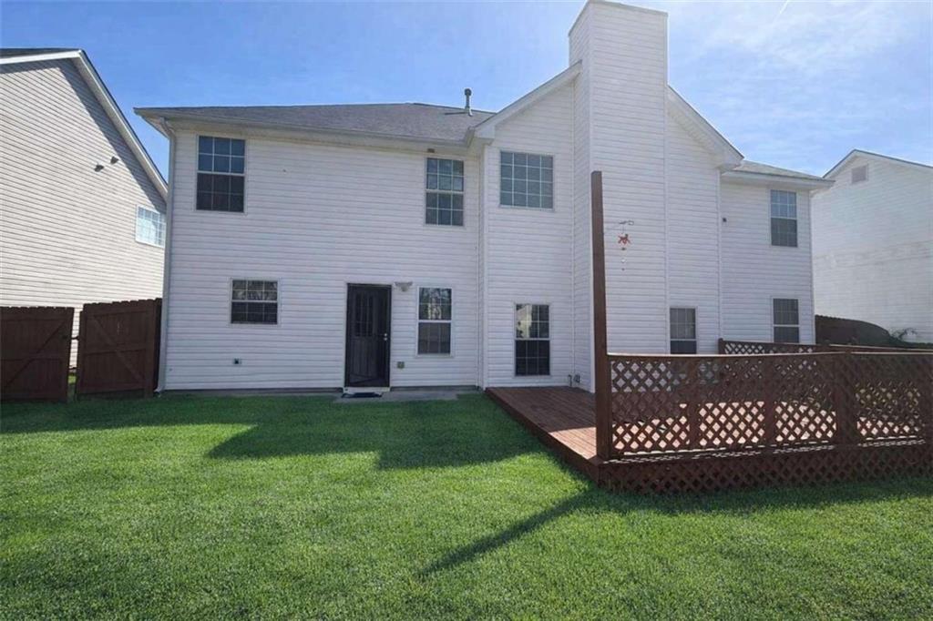135 Timberlake Terrace Covington, GA 30016 - Photo 6 of 6 a view of a house with a yard