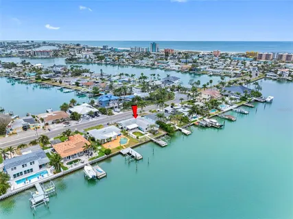 an aerial view of a houses with a lake view