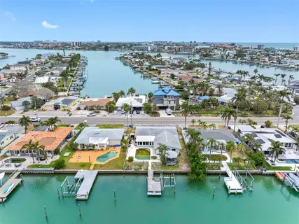 an aerial view of residential building with outdoor space and lake view