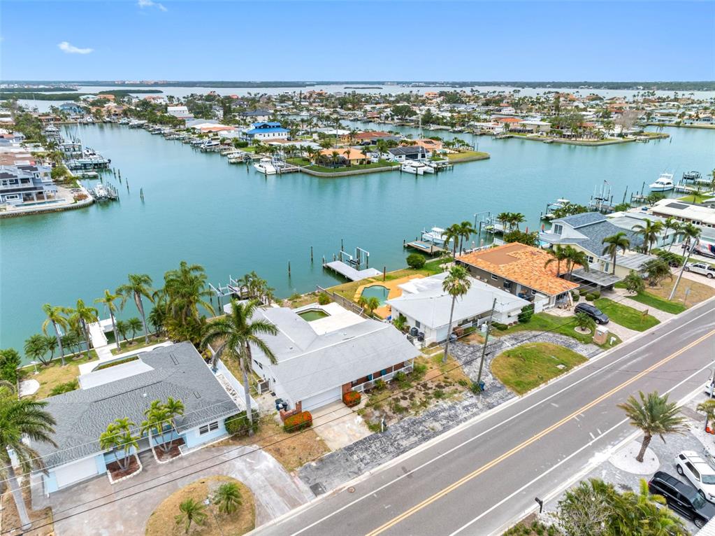 440 115th Avenue Treasure Island, FL 33706 - Photo 20 of 25 an aerial view of a house with a table and chairs