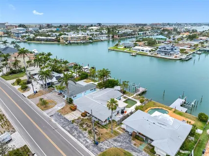 an aerial view of a house with a ocean view