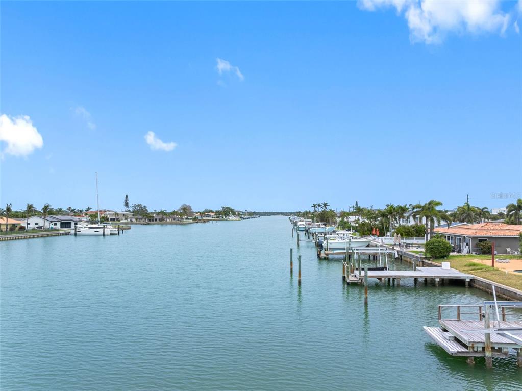 440 115th Avenue Treasure Island, FL 33706 - Photo 23 of 25 a view of a ocean with boats and trees in the background
