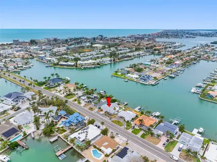 an aerial view of a houses with a lake view