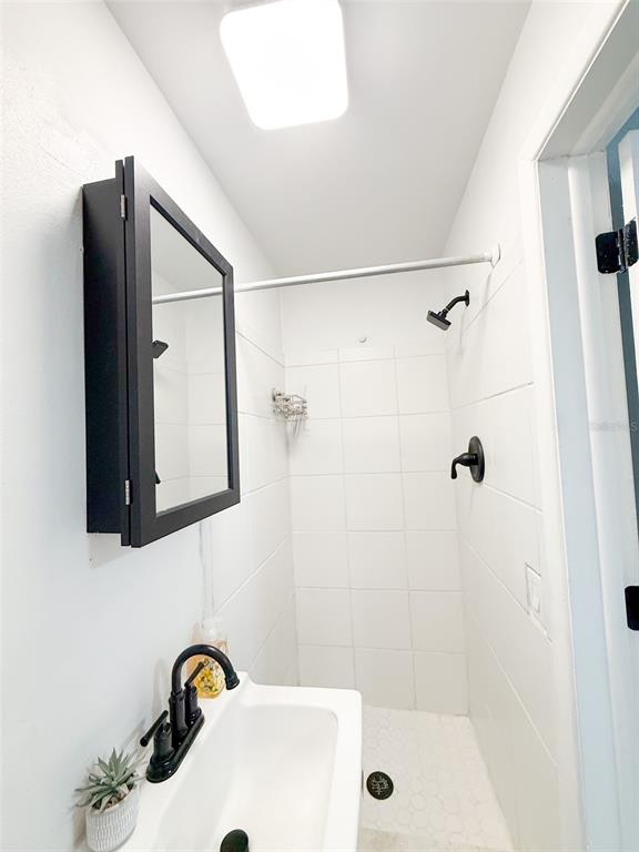 10805 Fillmore Avenue Port Richey, FL 34668 - Photo 23 of 32 a bathroom with a tub and a sink