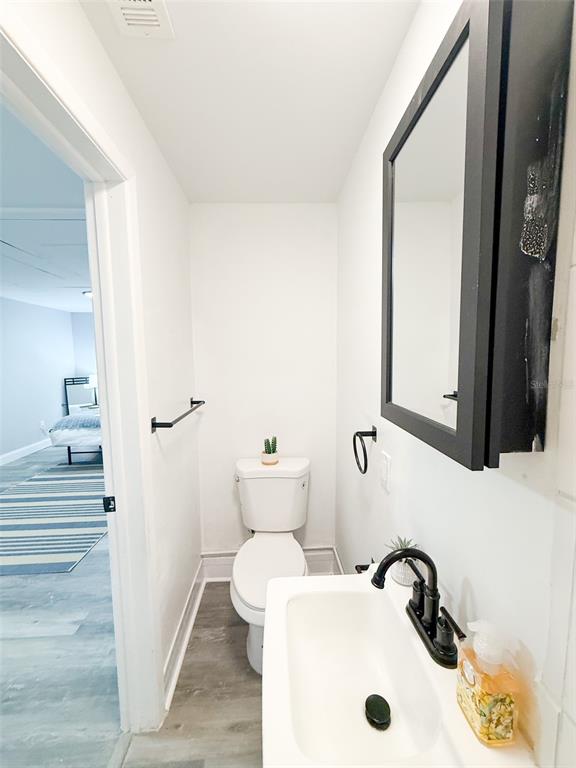10805 Fillmore Avenue Port Richey, FL 34668 - Photo 24 of 32 a bathroom with a sink and a mirror