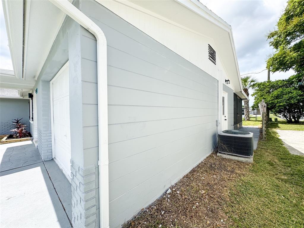 10805 Fillmore Avenue Port Richey, FL 34668 - Photo 32 of 32 a view of a porch with furniture and a yard