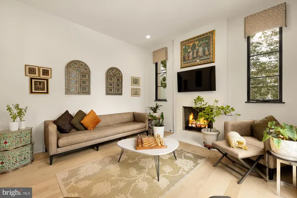 a kitchen with stainless steel appliances a white stove top oven a sink and dishwasher