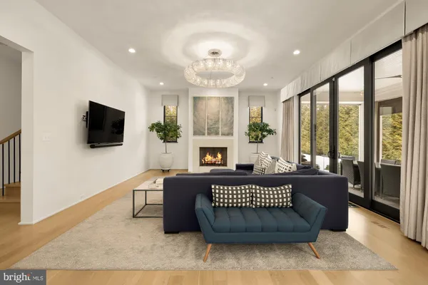 a large white kitchen with a large window