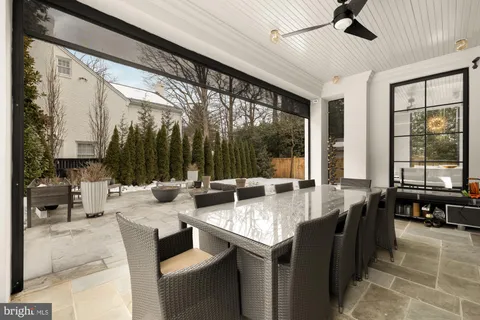 a spacious bathroom with a double vanity sink a bathtub and next to a window