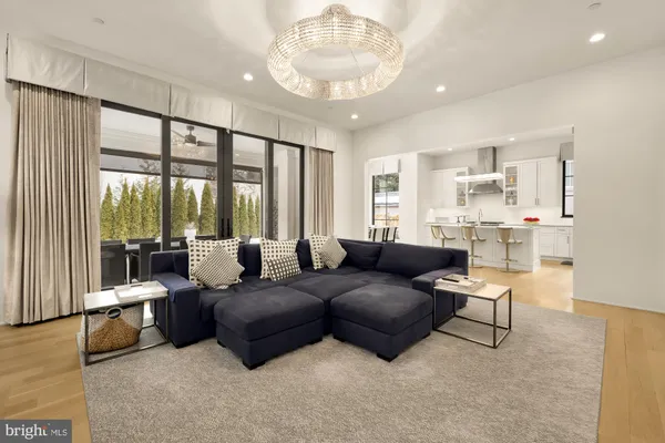 a spacious bathroom with a double vanity sink a bathtub and next to a window