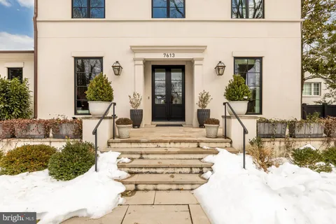 a hallway with a couch and wooden floor