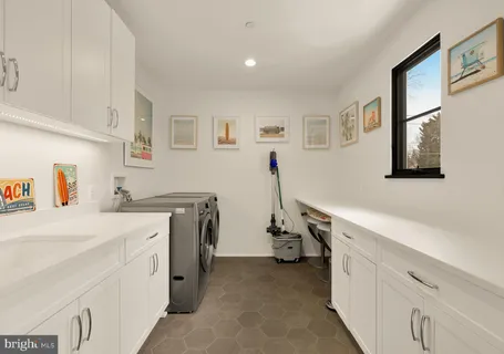a bathroom with a granite countertop sink a toilet and a shower