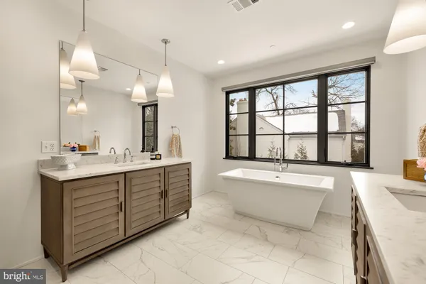 a bedroom with a bed and chair