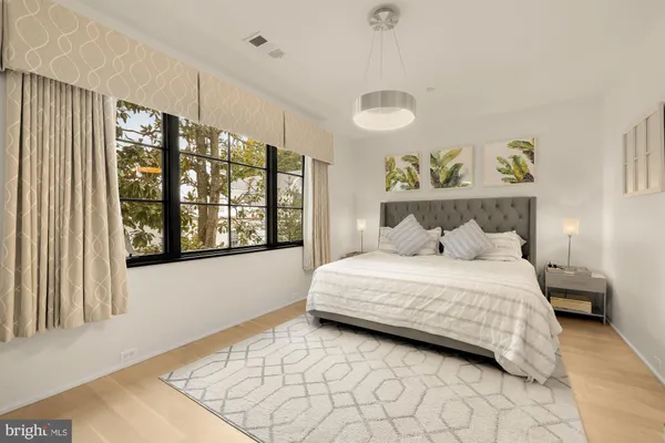 a view of swimming pool with sitting area and garden