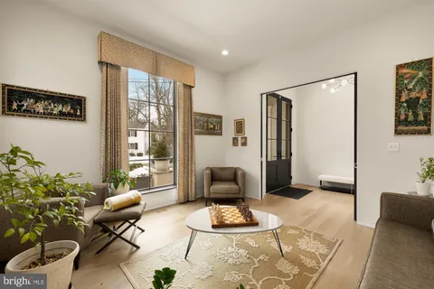a kitchen with stainless steel appliances a white stove top oven a sink and dishwasher