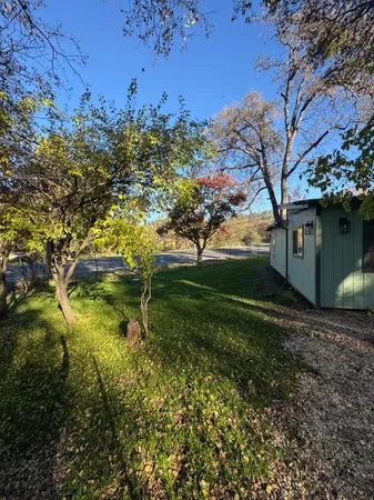 a backyard of a house with lots of green space