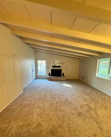 a view of a room that has a window