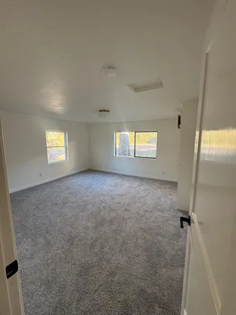 a view of an empty room and window