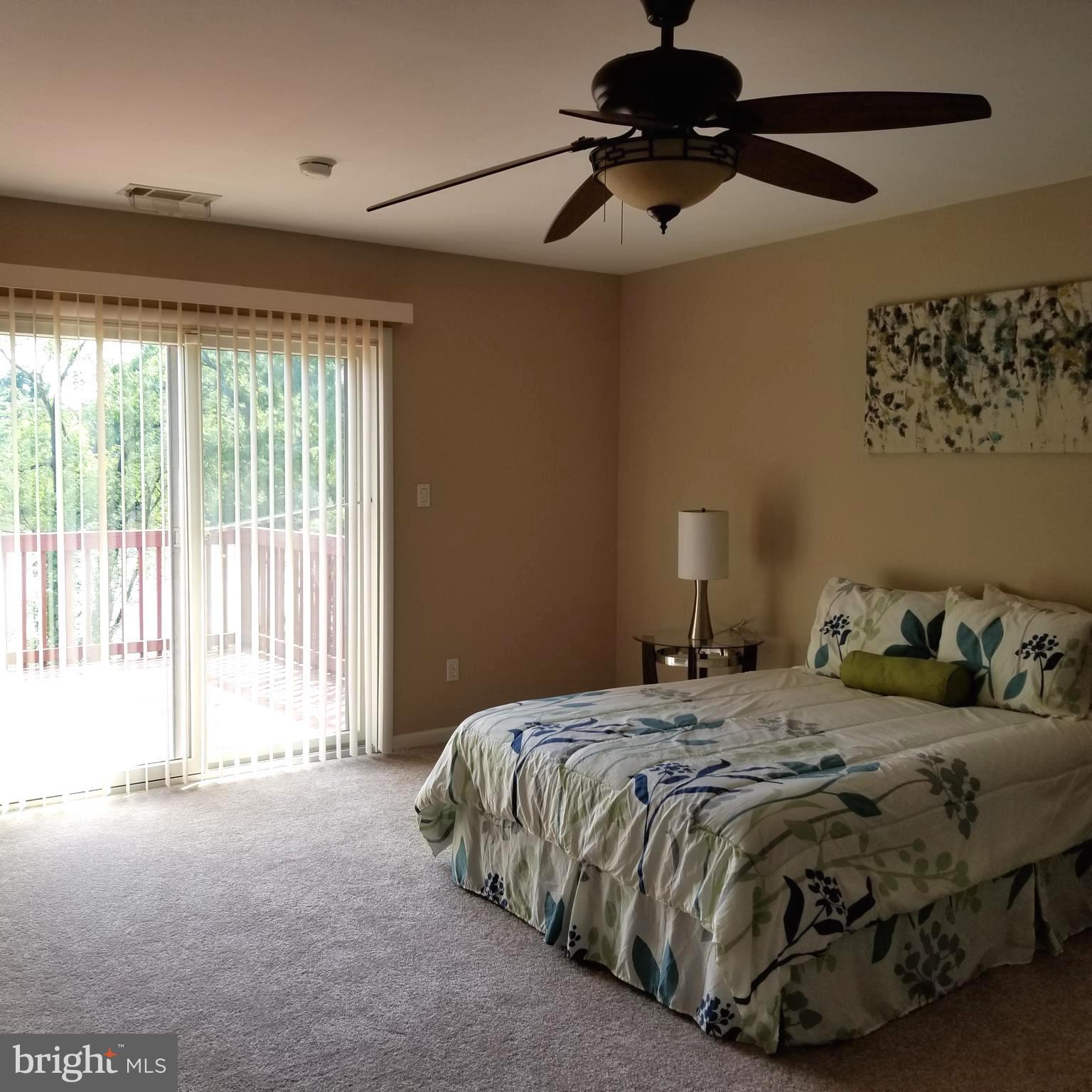 7903 Shore Road Baltimore, MD 21222 - Photo 24 of 41 Master Bedroom with patio door leads to deck