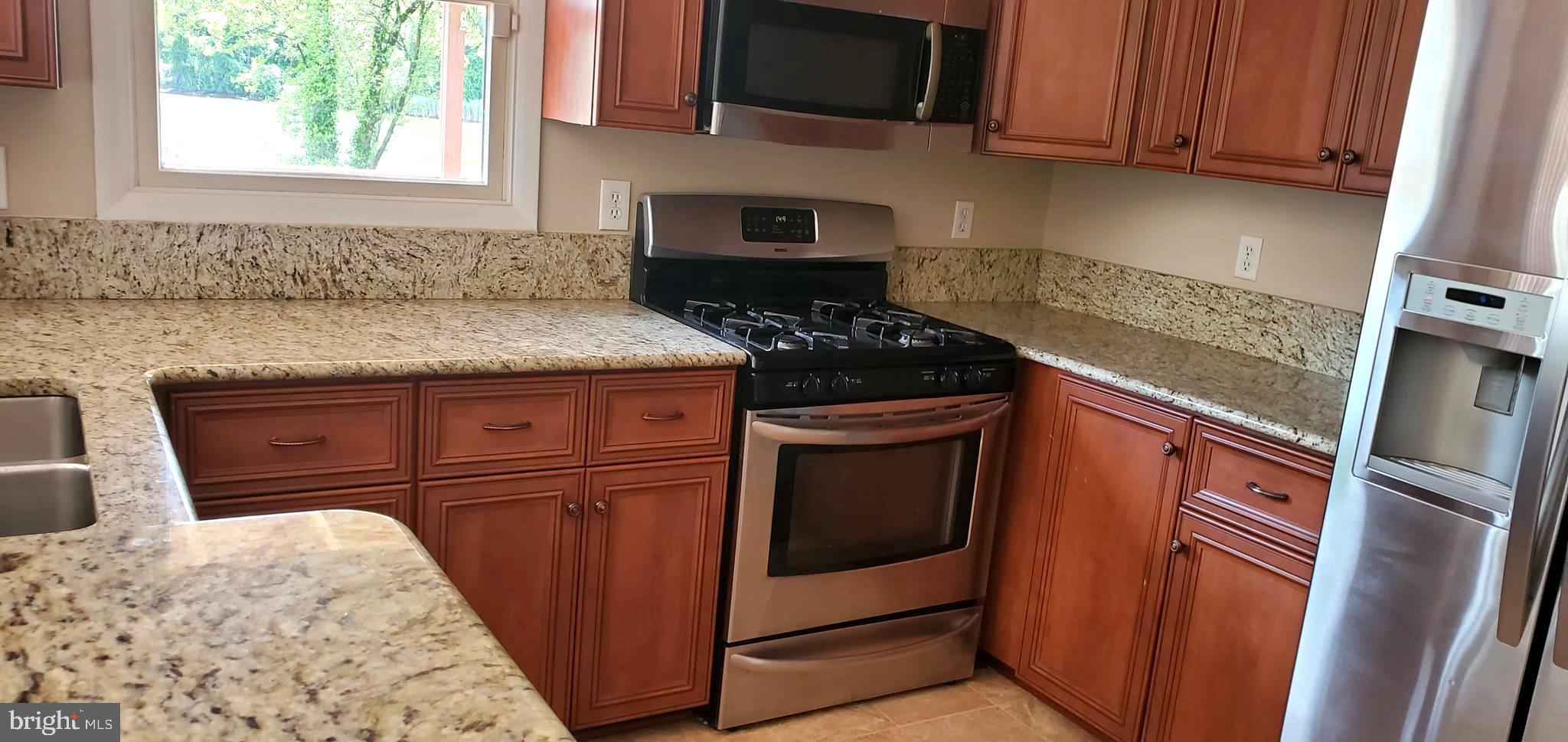 7903 Shore Road Baltimore, MD 21222 - Photo 7 of 41 Kitchen w/ stainless appliances + granite counters