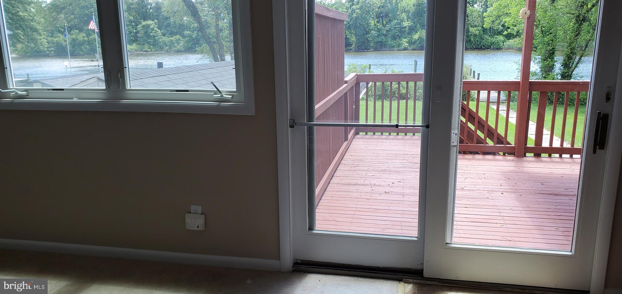 7903 Shore Road Baltimore, MD 21222 - Photo 9 of 41 Kitchen and dining area leads to deck with a view