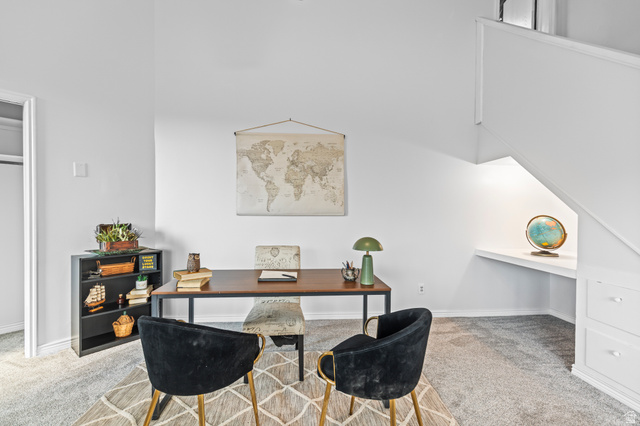460 Omni Point Road Central Valley, UT 84754 - Photo 47 of 101 Carpeted area featuring built-in shelving, white walls, and a built-in desk under the staircase