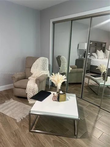 a view of a livingroom with furniture and entryway