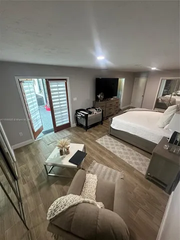 a view of walk in closet with empty room