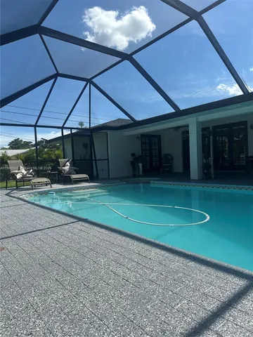 a view of a swimming pool with a patio