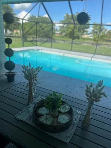 a living room with couches and a coffee table with wooden floor