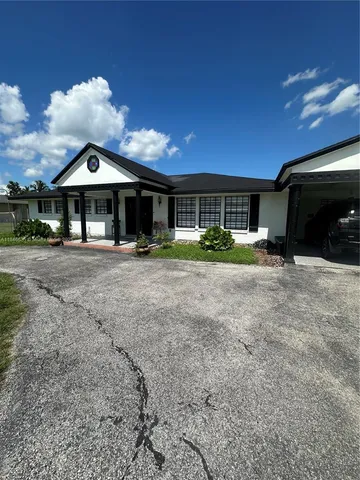 a view of a yard with patio