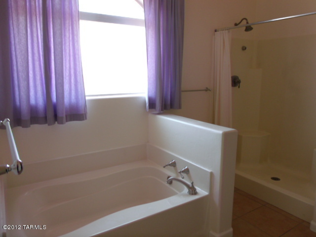1490 Circulo Jacona Rio Rico, AZ 85648 - Photo 16 of 29 a bathroom with a bathtub