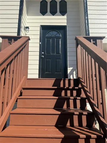 a view of entryway with a front door