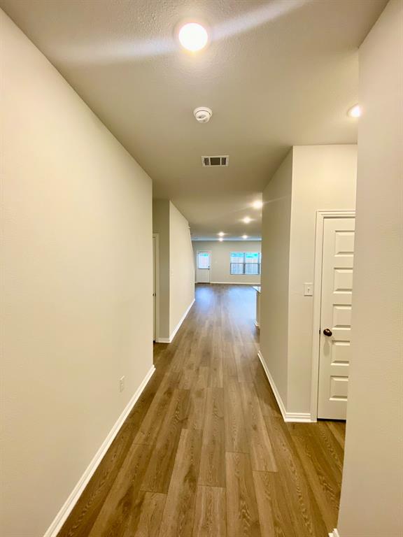 615 Metallic Tree Lane Van Alstyne, TX 75495 - Photo 7 of 24 a view of gallery with wooden floor
