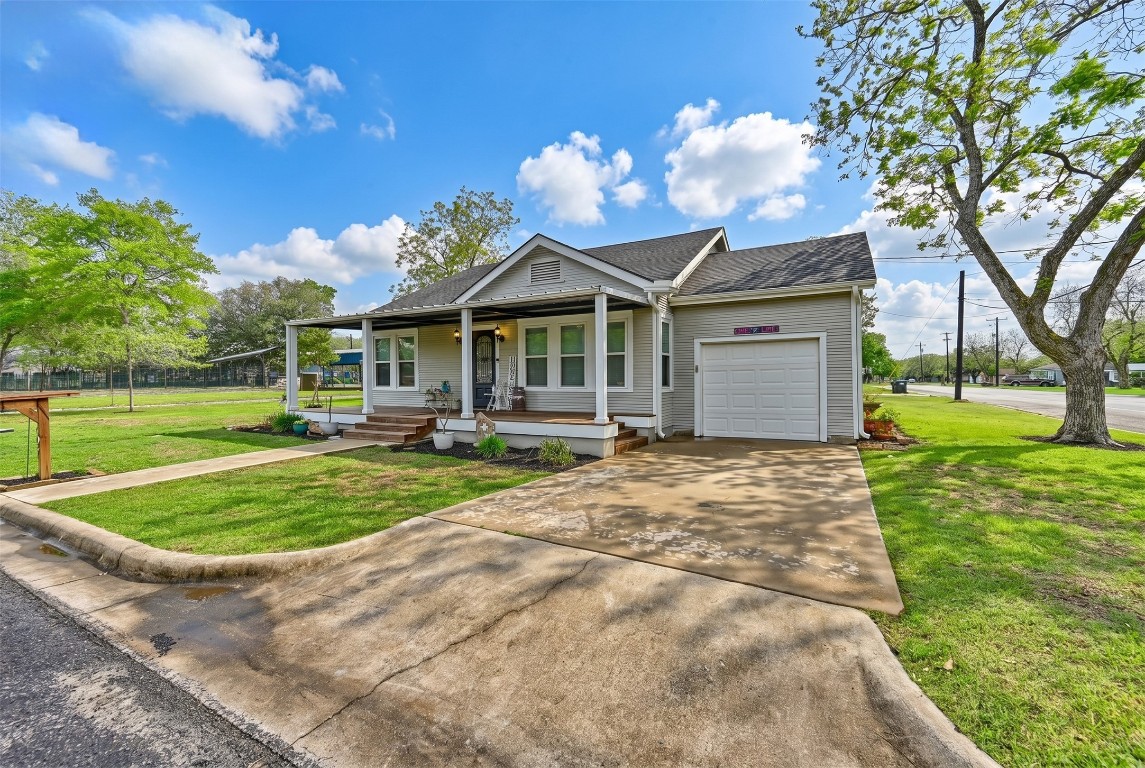 407 North Summit Street Weimar, TX 78962 - Photo 14 of 24 a view of a house with a yard