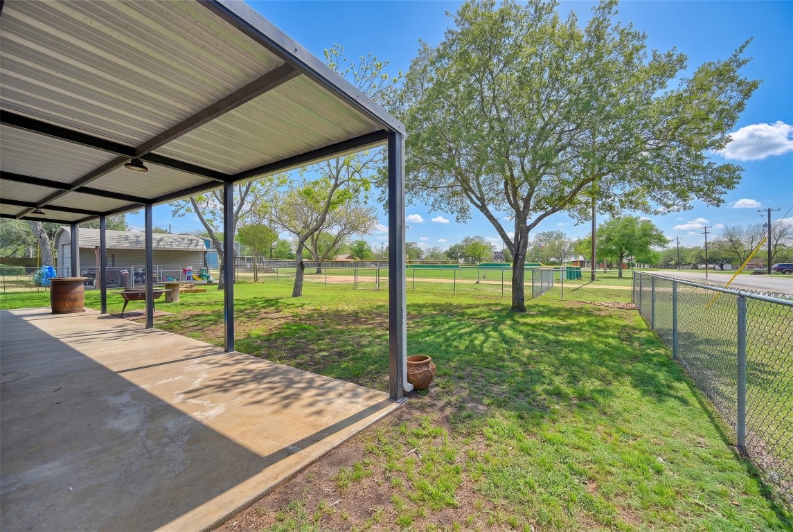 407 North Summit Street Weimar, TX 78962 - Photo 21 of 24 a view of a backyard with green space
