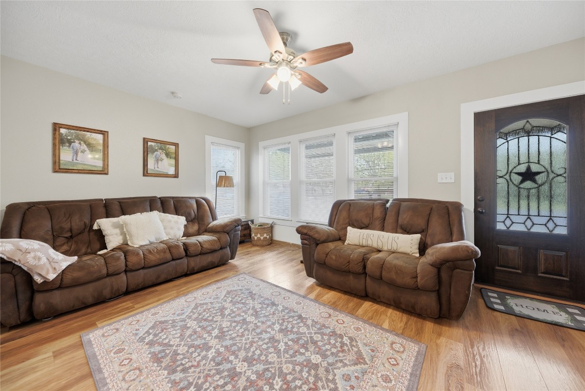 407 North Summit Street Weimar, TX 78962 - Photo 4 of 24 a living room with furniture and a window