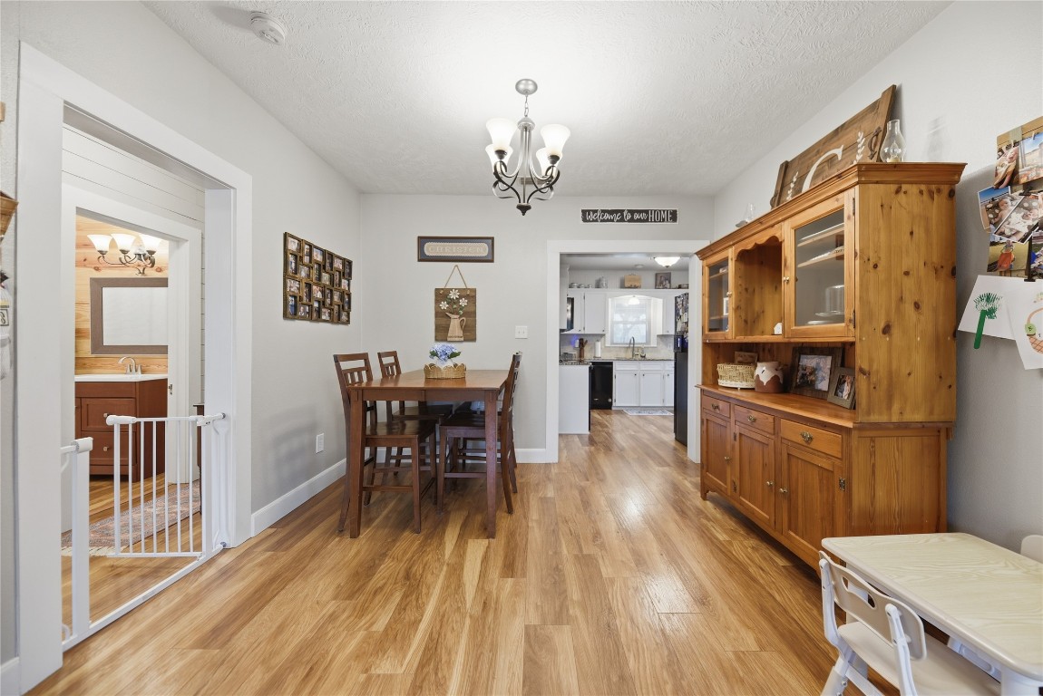 407 North Summit Street Weimar, TX 78962 - Photo 5 of 24 a view of a dining room with furniture window and wooden floor