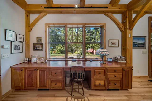a view of a dining room with furniture and window