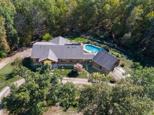 an aerial view of a house with a garden