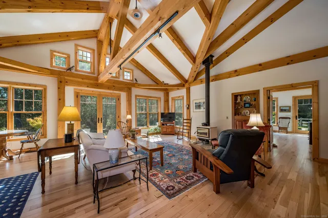 a building outdoor space with patio furniture and wooden floor