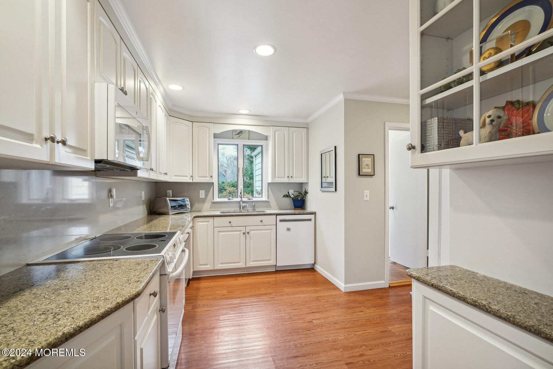 23 Little Silver Point Road Little Silver, NJ 07739 - Photo 7 of 35 a kitchen with granite countertop a sink and cabinets