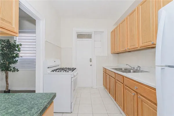 a kitchen with stainless steel appliances granite countertop a stove and a sink